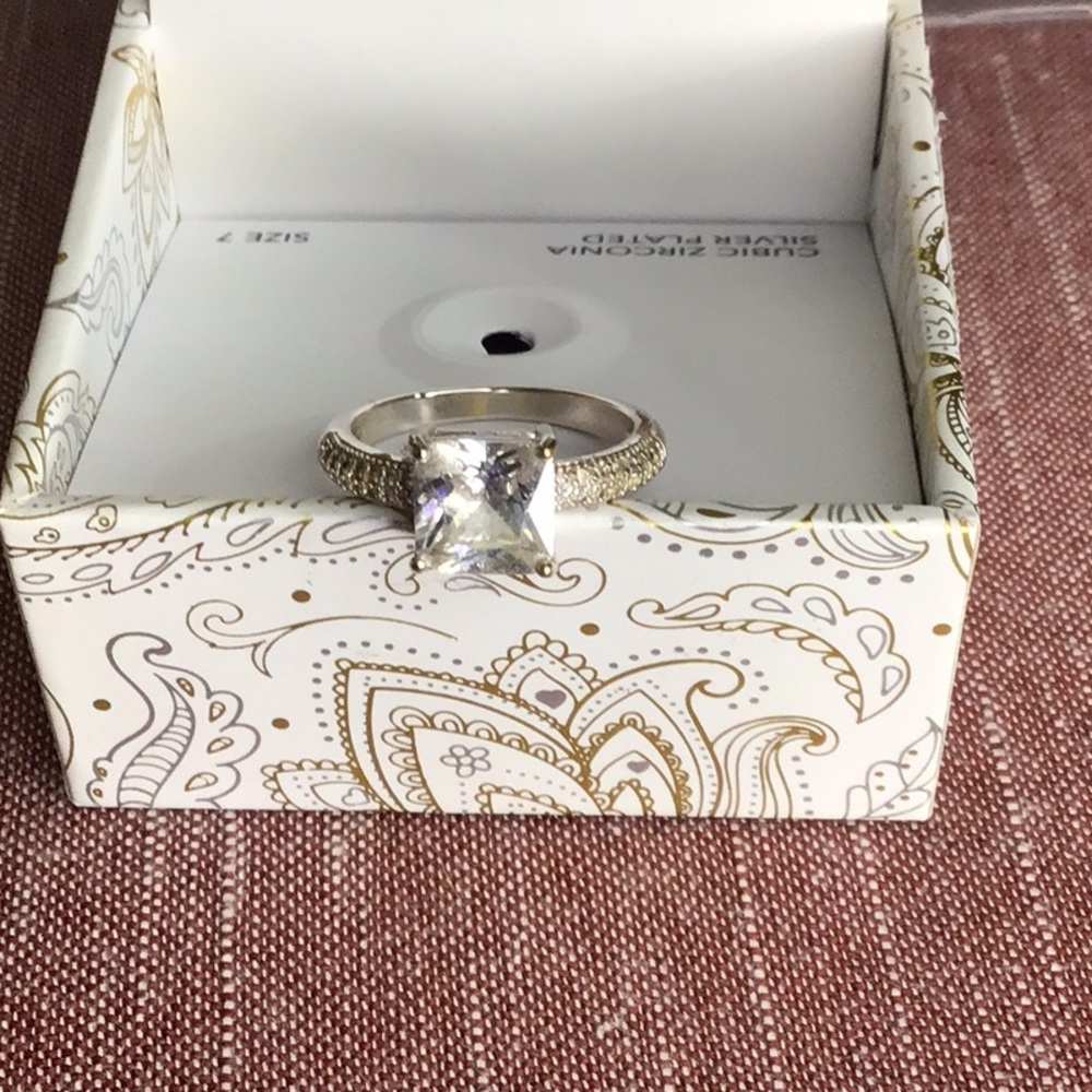 New in box size 7 cubic zirconia , a silver plated ring